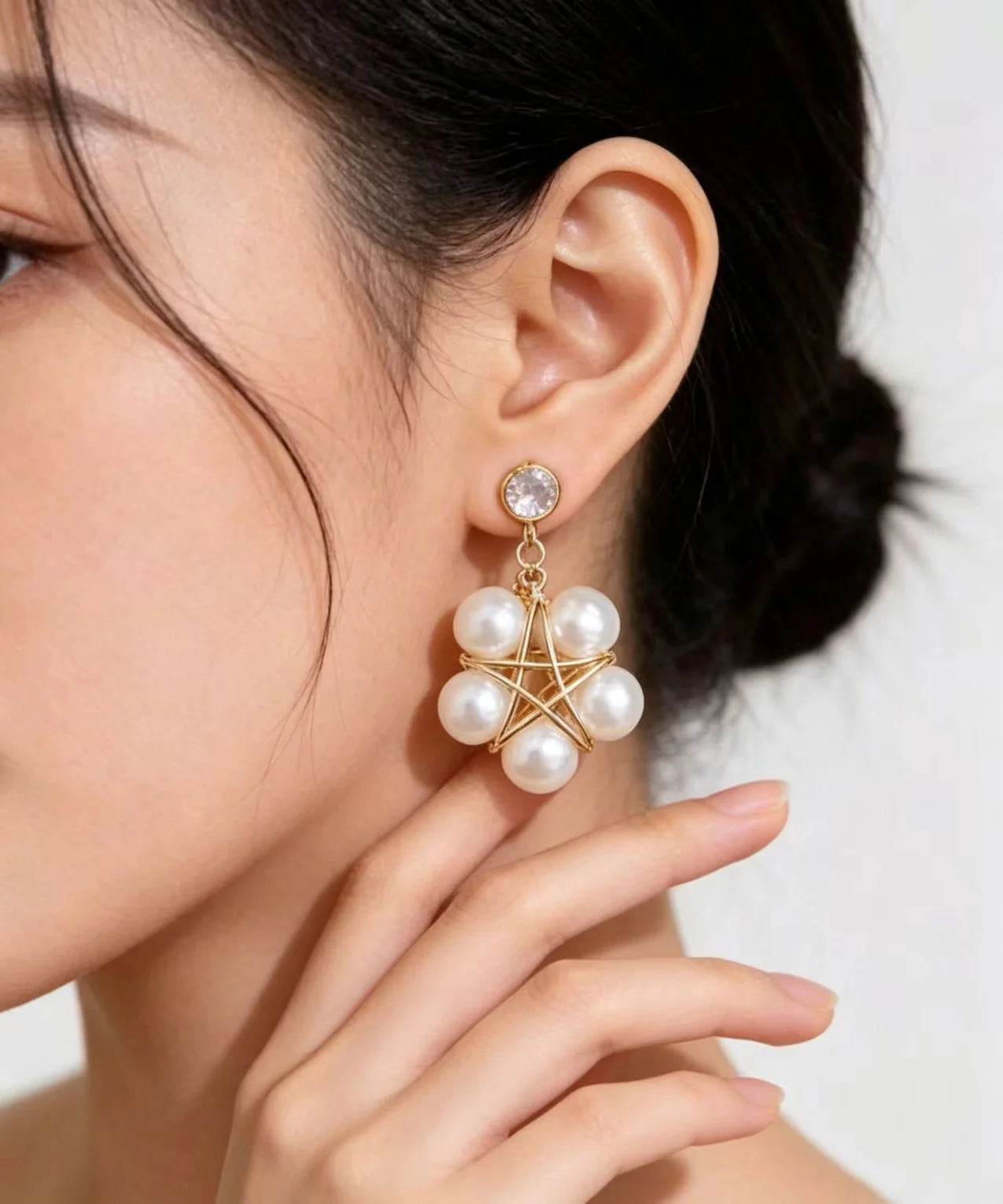 Boucles d'oreilles pendantes femme forme étoile à cinq branches 3