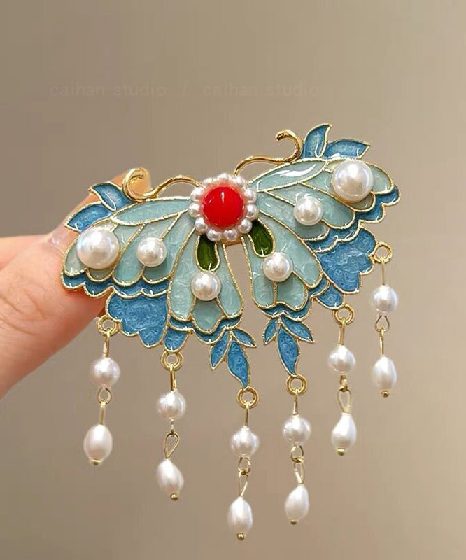 Épingle à cheveux papillon bleu avec perle et gland 1