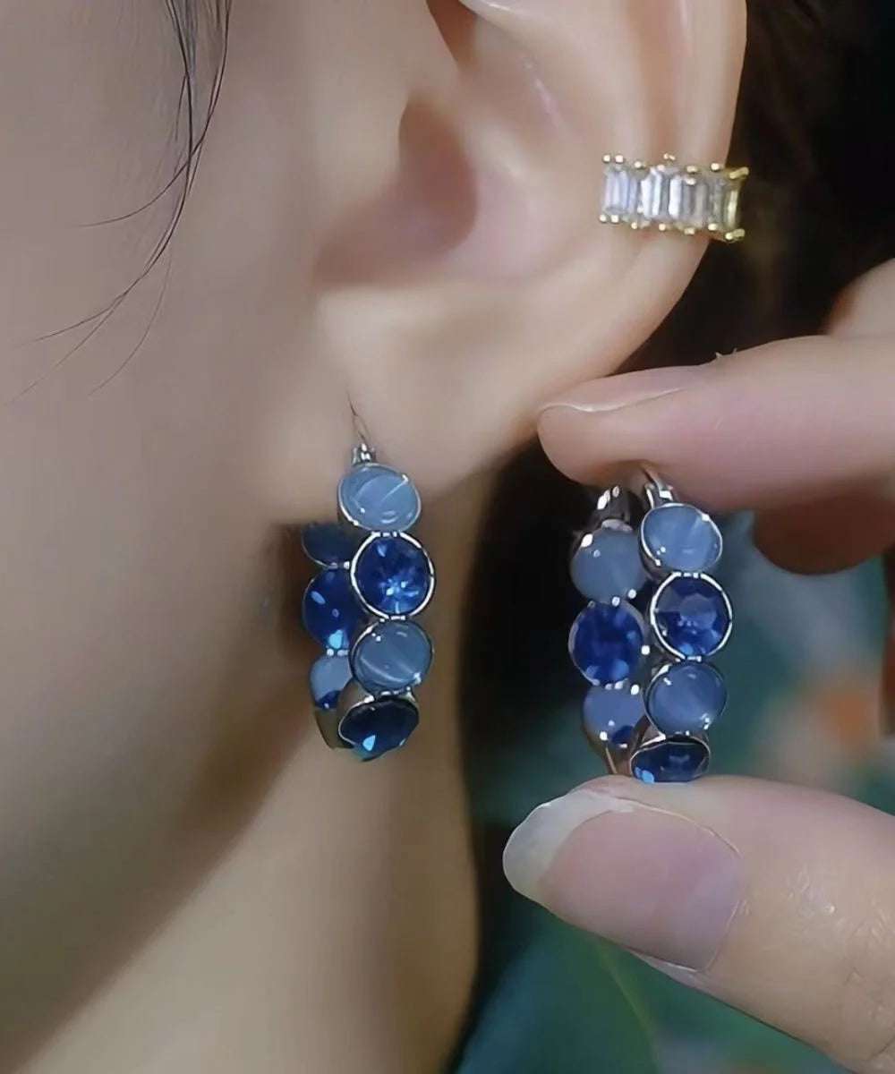 Boucles d'oreilles créoles pour femme style œil de chat 1