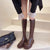 Bottes longues en cuir pour femmes