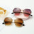 Lunettes de soleil sans monture avec strass
